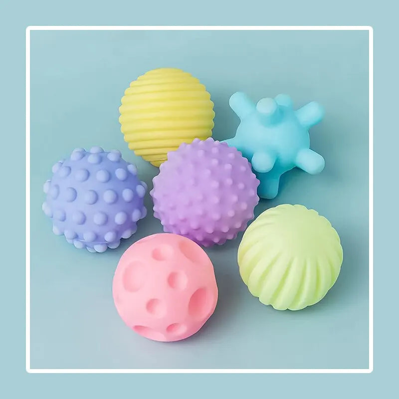 Set of colorful textured balls on a light blue background