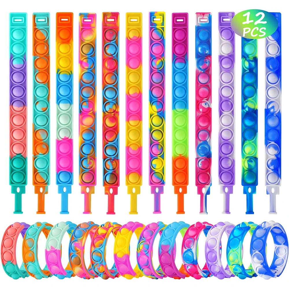 Set of colorful pop-it wristbands with various designs on a white background.