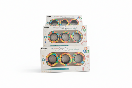 Three packages of a colorful ring product on a wooden surface with a blurred background.