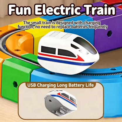 Toy electric train set with USB charging feature on a wooden surface
