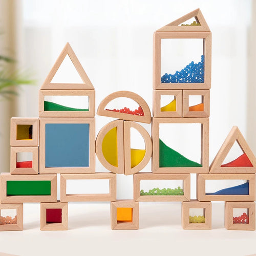 Wooden building blocks with colorful shapes and textures on a light background