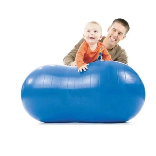 Man and child playing with a large blue exercise ball on a white background