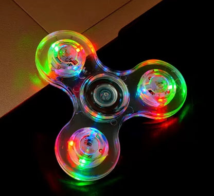 Colorful LED spinner on a dark surface