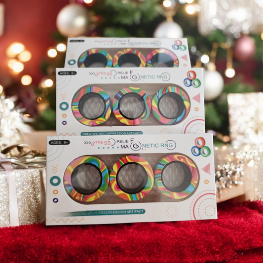 Stack of colorful magnetic ring packaging with a festive background