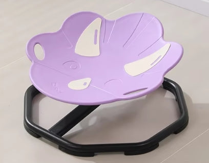 Purple children's seat with cartoon design on a light gray floor