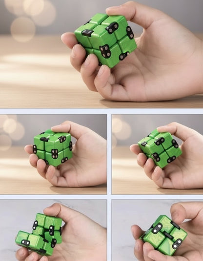 Green fidget cube being manipulated by hands on a white background