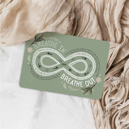 Green card with breathing exercise design on a textured fabric background