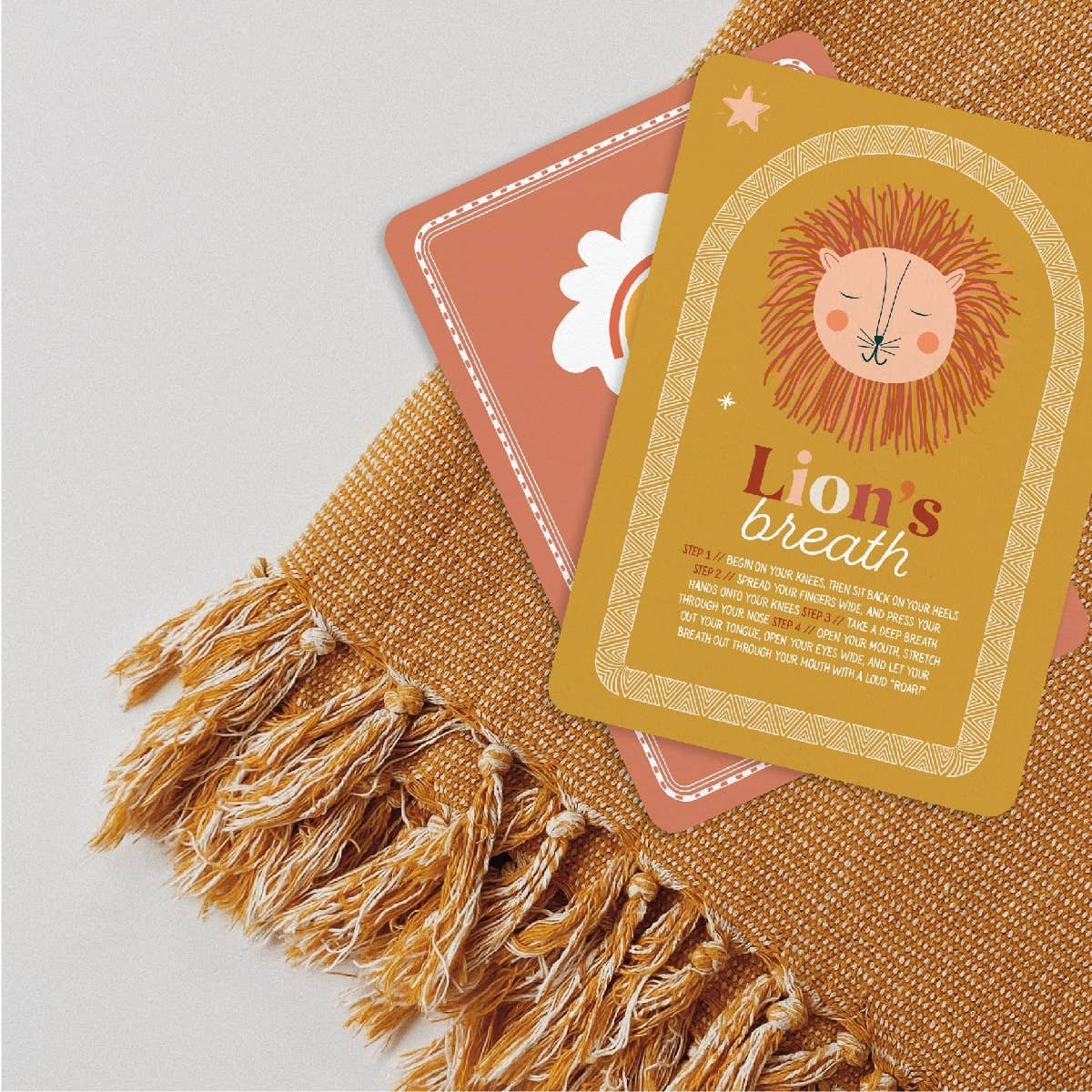 Card with a lion illustration and 'Lion's Breath' text on a textured surface