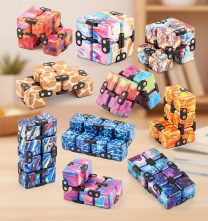 Collection of colorful fidget cubes in various patterns on a white background
