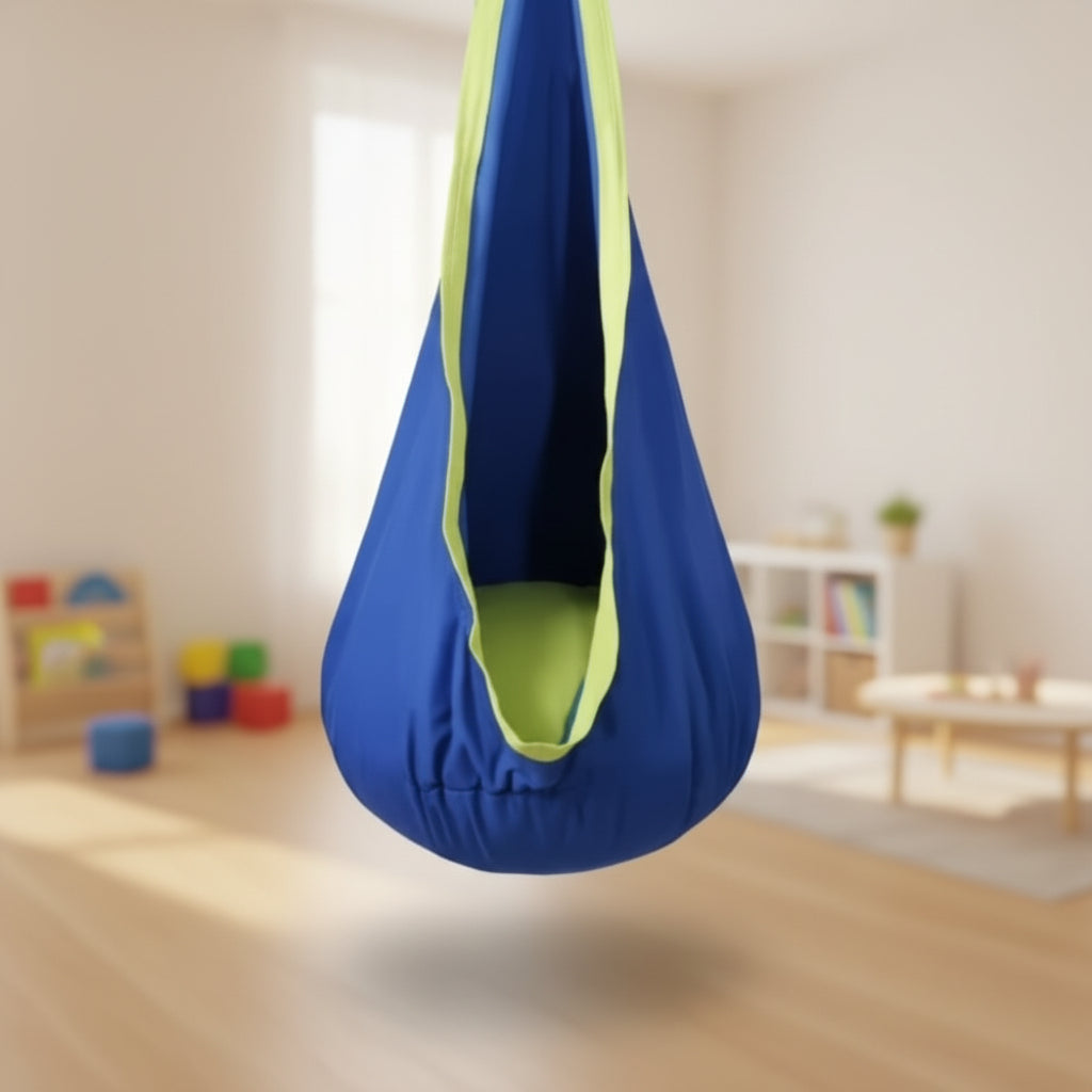 Blue hanging sensory chair in a living room setting with a plant and wall decorations.